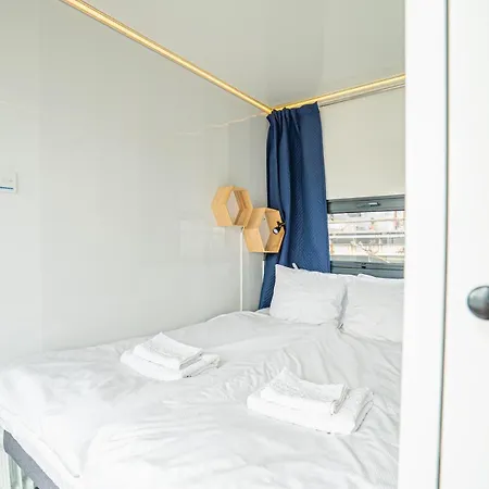 At Sea Houseboat With Rooftop In The Heart Of By Beyond *