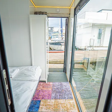 At Sea Houseboat With Rooftop In The Heart Of By Beyond *