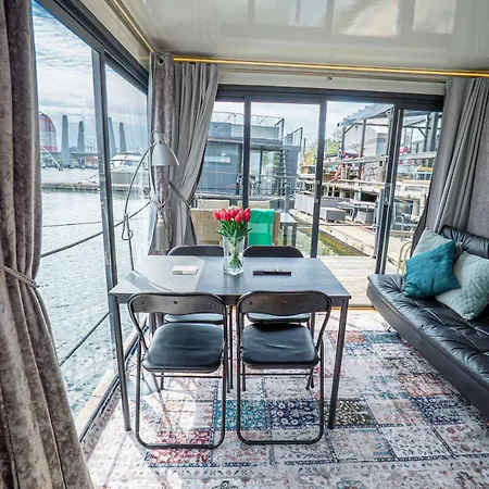 At Sea Houseboat With Rooftop In The Heart Of By Beyond